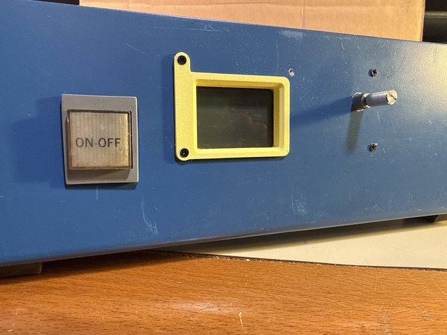 The front panel: a square ON-OFF switch, the Nokia 5110 LCD in a yellow 3D-printed bezel, and the rotary encoder shaft